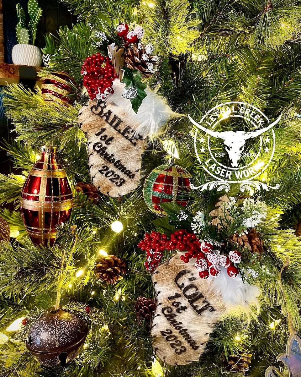 Custom cowhide mini stocking ornaments displayed as personalized western Christmas keepsakes