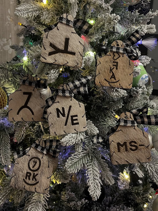 Personalized Double-Sided Cow Tag Christmas Ornament with Checkered Bow - custom laser engraved cowhide and leather western decor by Lethal Creek Laser Works LLC