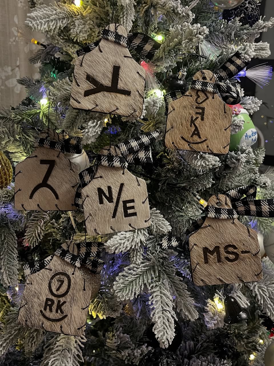 Custom western cow tag Christmas ornaments with brands, initials and black and white checkered bows