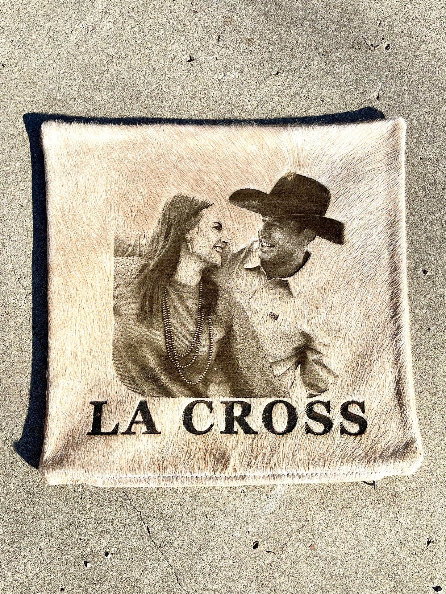 Custom photo laser branded cowhide pillow case featuring a western cowboy couple, personalized western home decor and heirloom gift