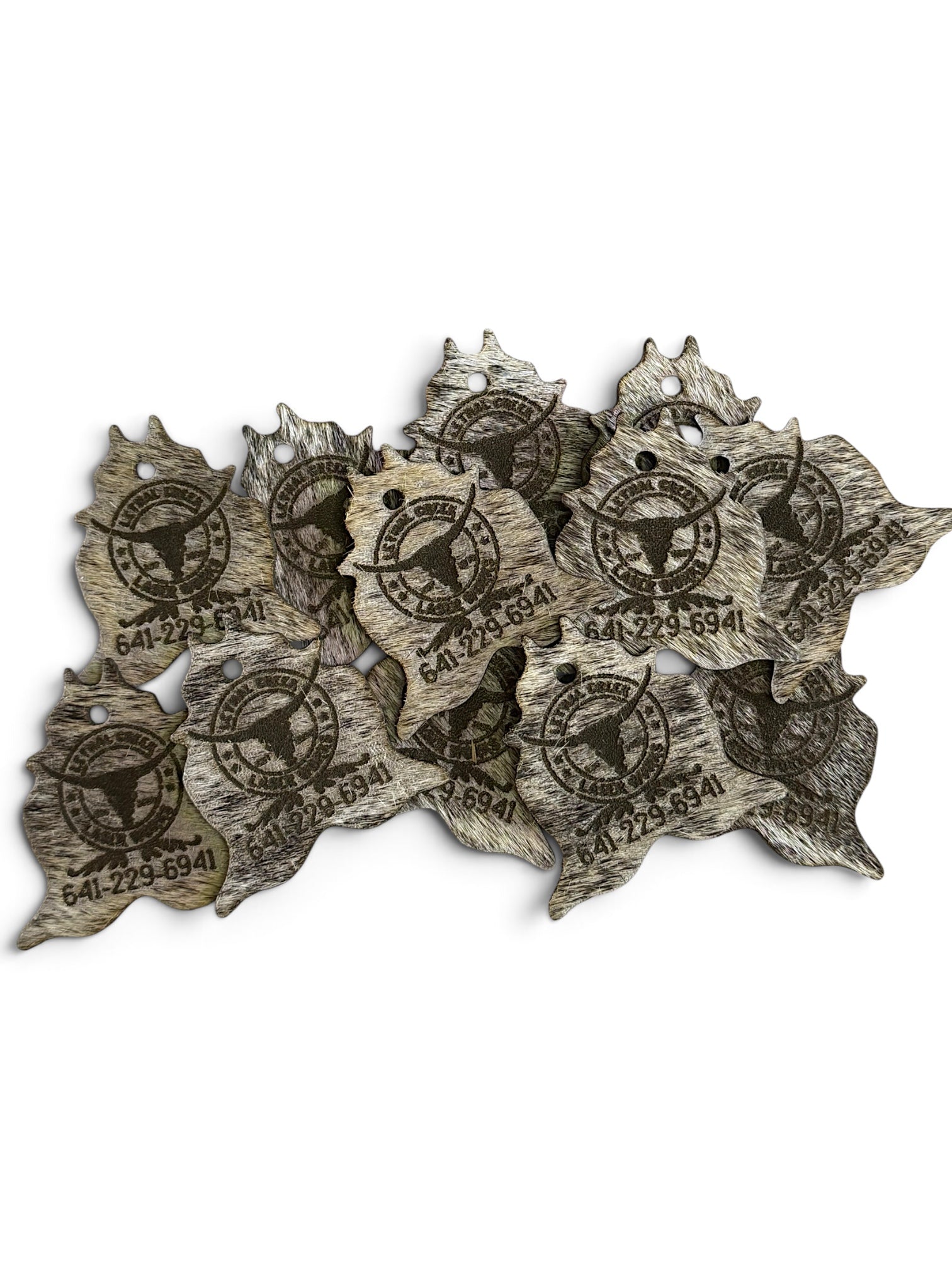 Bulk genuine cowhide keychains custom laser branded for wholesale business, farm and ranch orders.