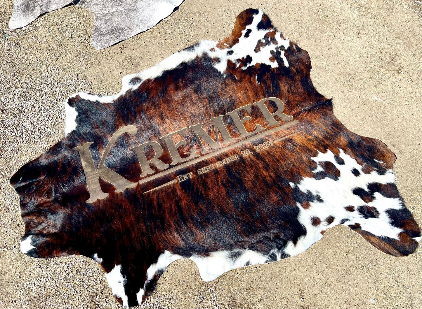 Custom Cowhide Backdrop | Western & Rustic Wedding Decor -  custom laser engraved cowhide and leather western decor by Lethal Creek Laser Works LLC