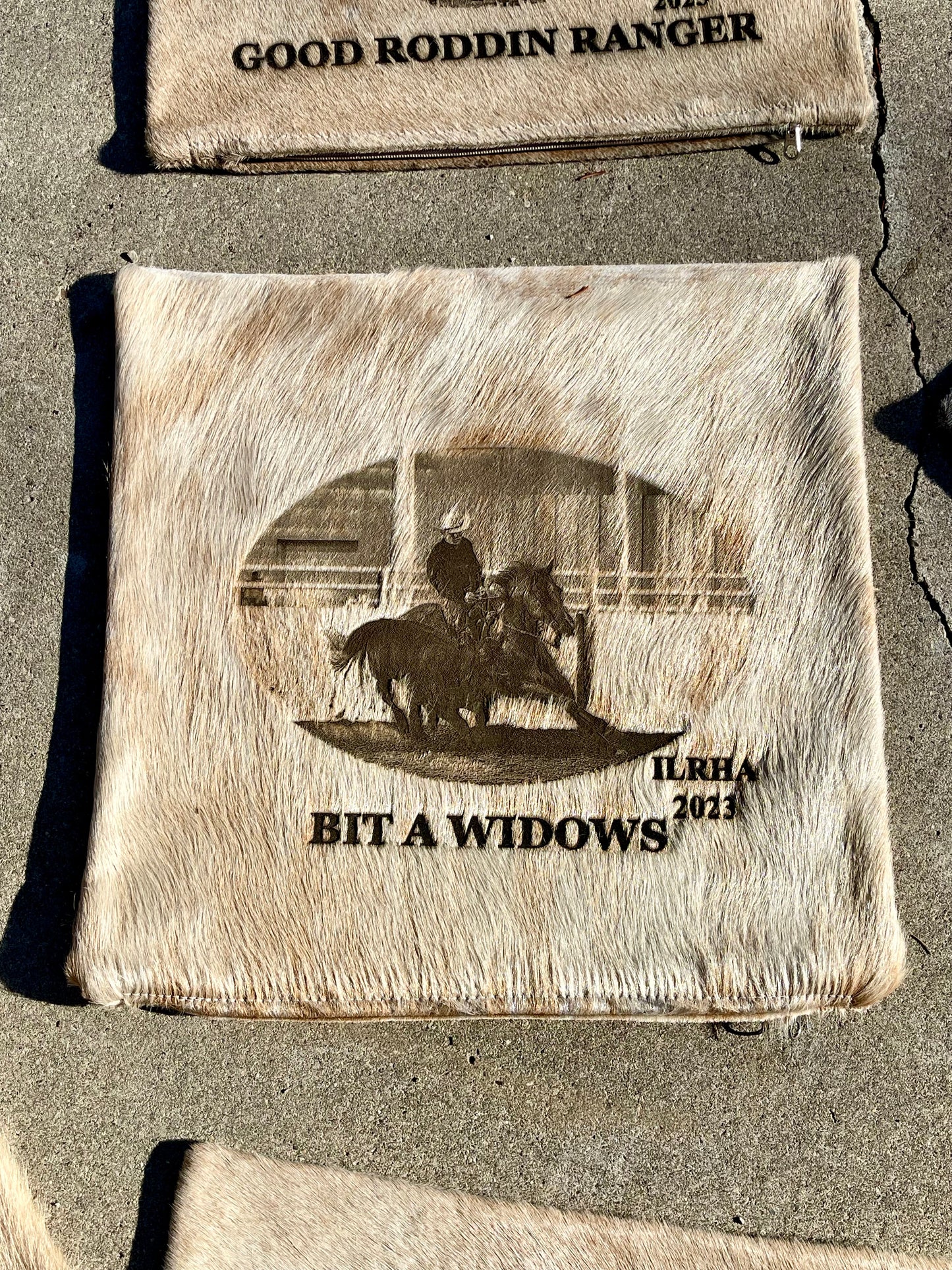 Custom equine award cowhide pillow case laser branded with horse and rider photo
