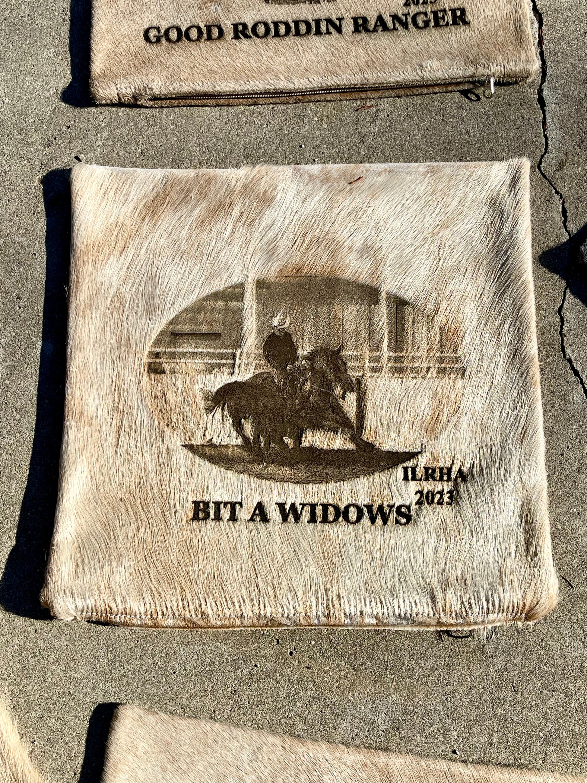 Custom equine award cowhide pillow case laser branded with horse and rider photo