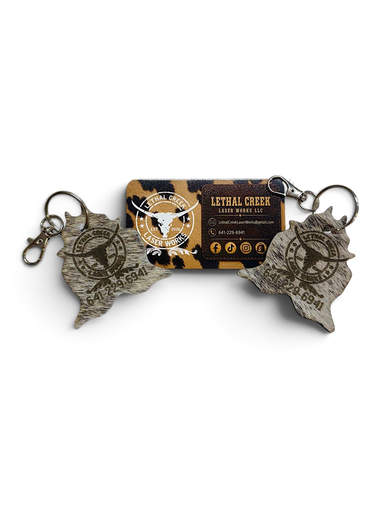 Custom laser branded genuine cowhide keychains with business logo, designed for ranches, farms and small businesses ordering personalized or bulk keychains.