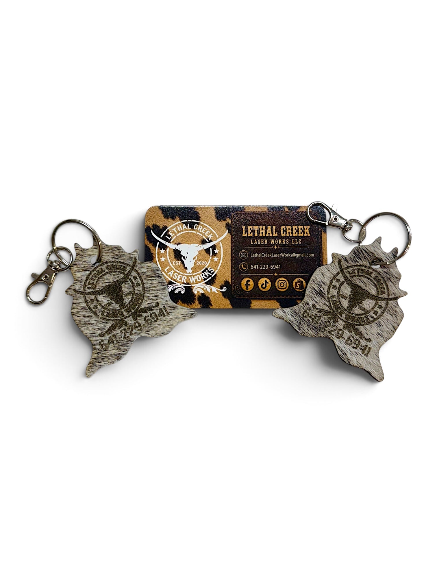 Custom laser branded genuine cowhide keychains with business logo, designed for ranches, farms and small businesses ordering personalized or bulk keychains.