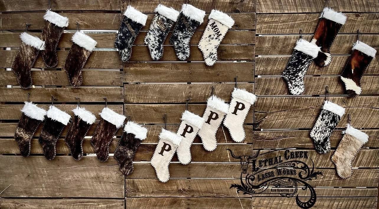 Matching family cowhide Christmas stockings personalized with initials and western styling
