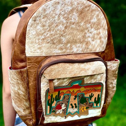 Thunderbird Backpacks -  custom laser engraved cowhide and leather western decor by Lethal Creek Laser Works LLC